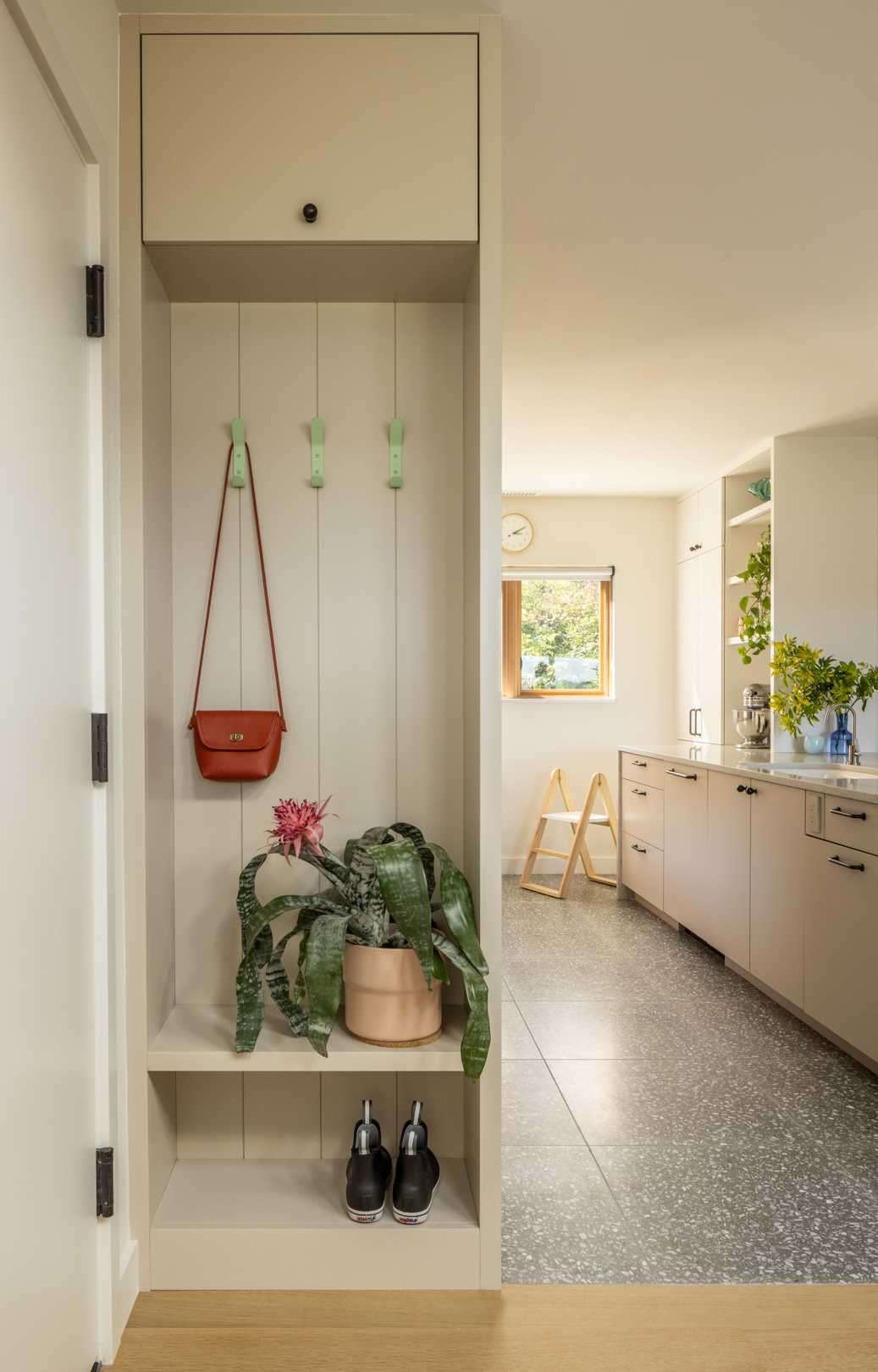 This new kitchen features a functional “U” shape with natural stone countertops, offering seamless access to the dining and living areas for a connected main floor experience.