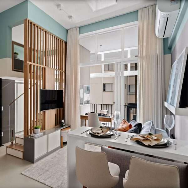 A small apartment with a loft bedroom has a variety of smart storage and design features.