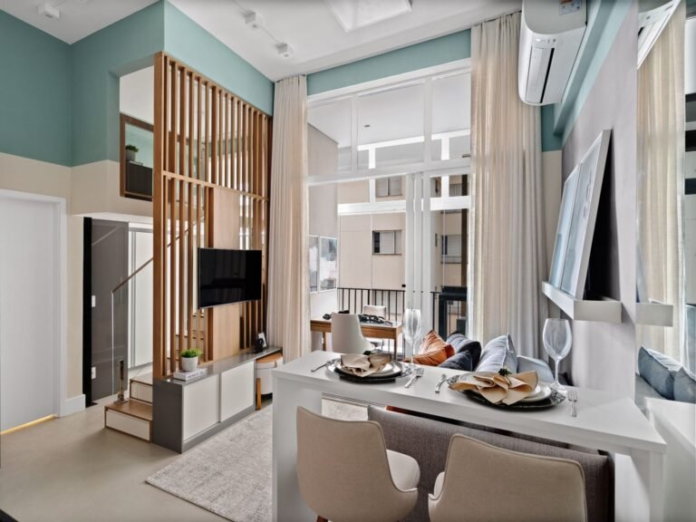 A small apartment with a loft bedroom has a variety of smart storage and design features.