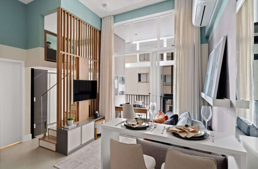 A small apartment with a loft bedroom has a variety of smart storage and design features.