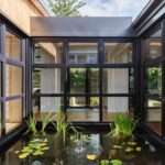 Step inside this Japanese-inspired home extension that's wrapped around a reflection pool