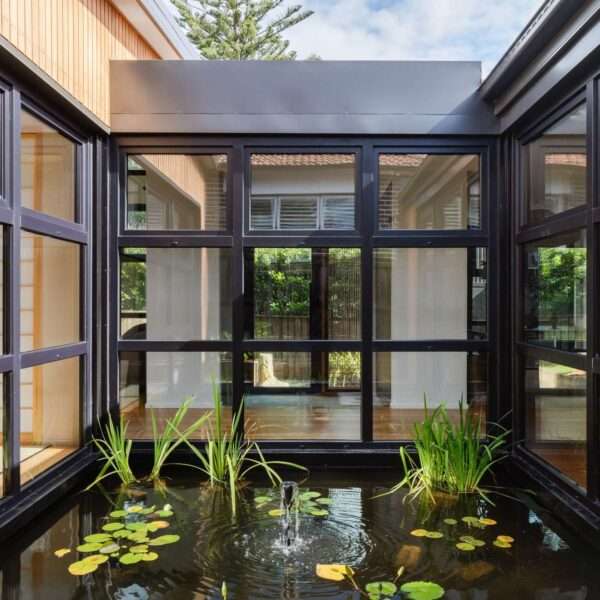 Step inside this Japanese-inspired home extension that's wrapped around a reflection pool