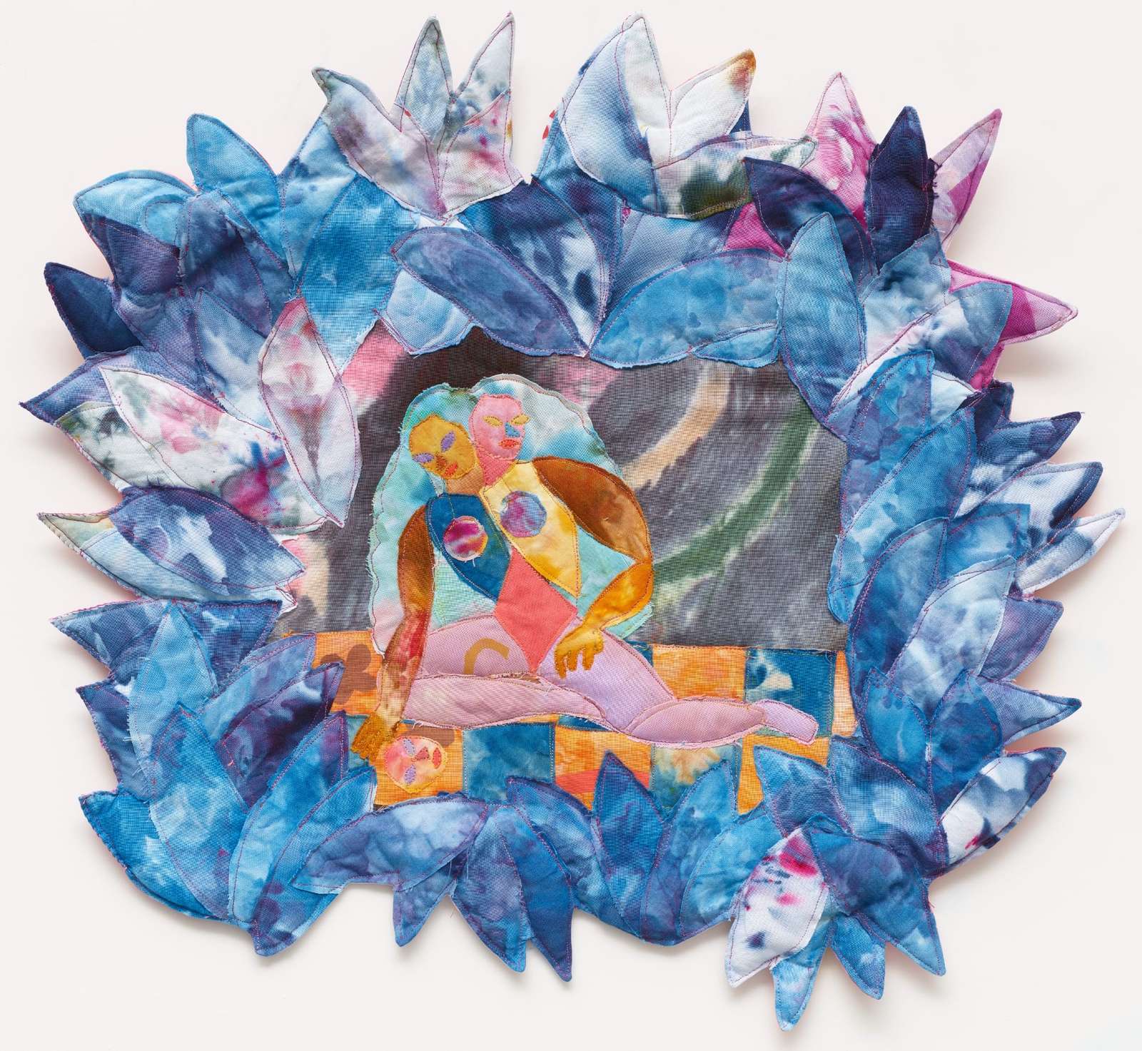 a textile portrait of abstract figures framed by blue leaves