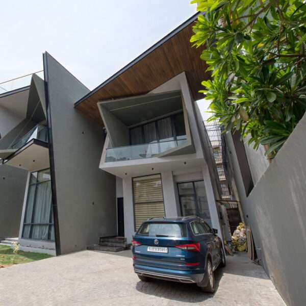 jagged planes in steel and concrete sculpt casa acentuada by smart arch studio in india