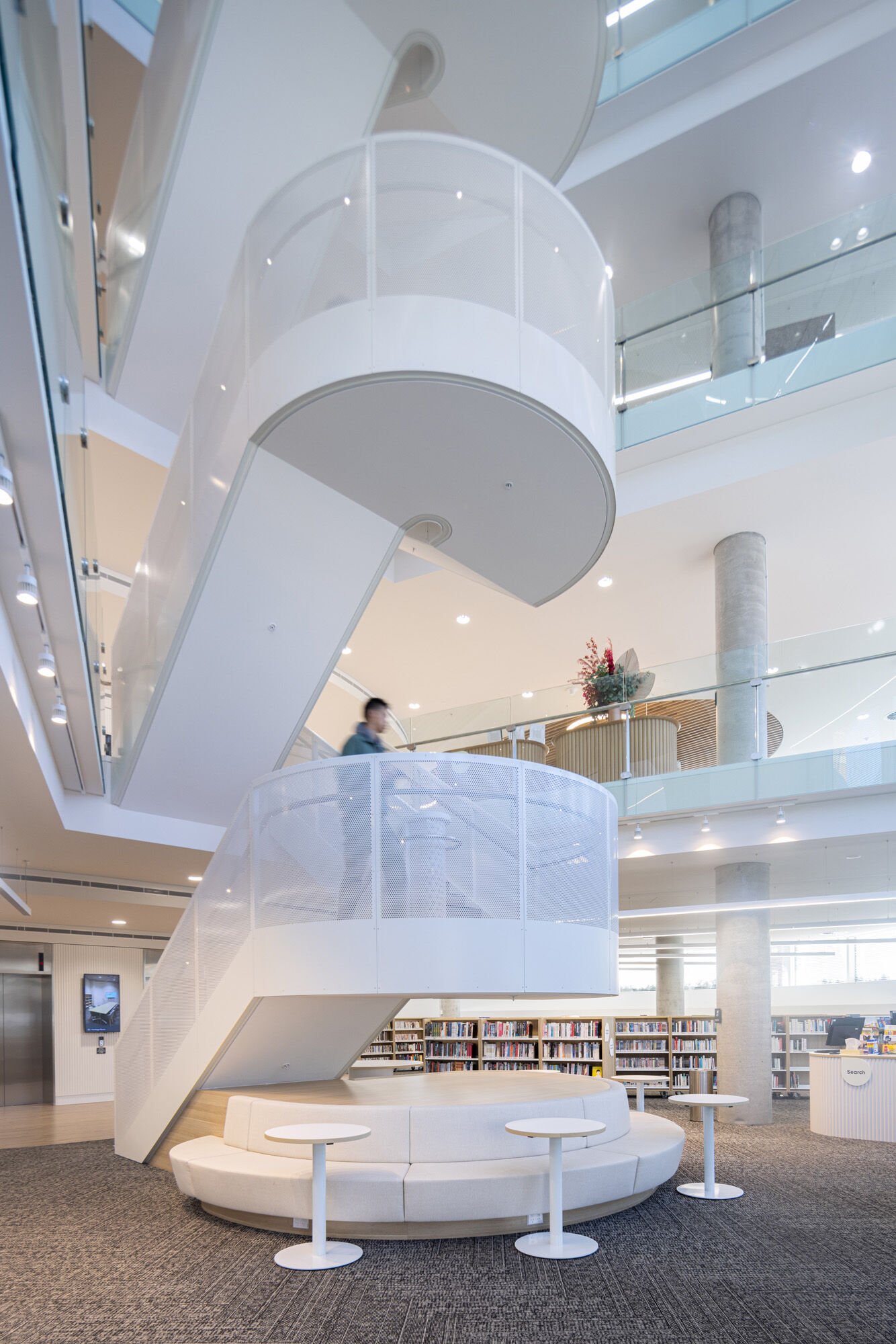 The centrally located stairs inside a modern library.