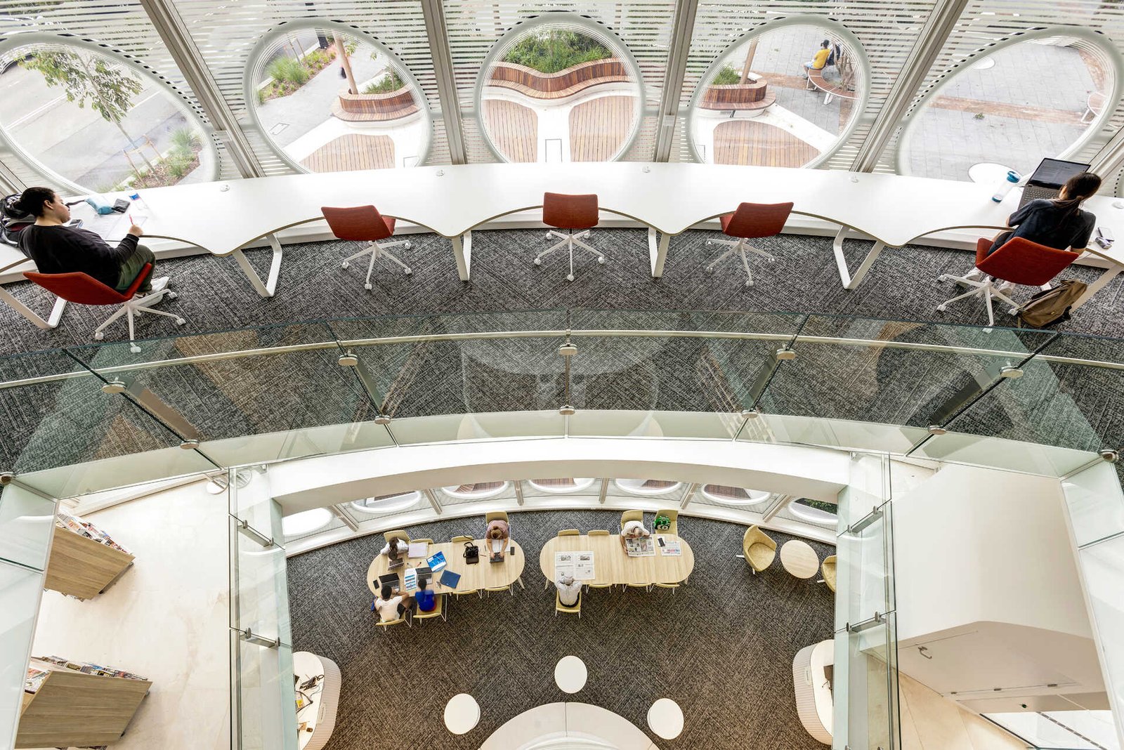 Legible site lines through voids connect floors, while groups and gathering is encouraged, so too are the individual settings at each window.