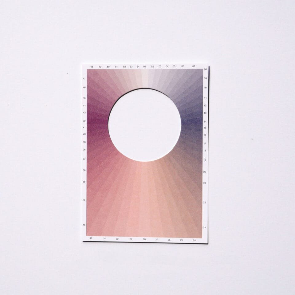 a postcard with a hole in the middle