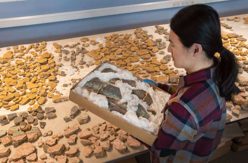 a researcher works on arranging fragments of a Roman fresco