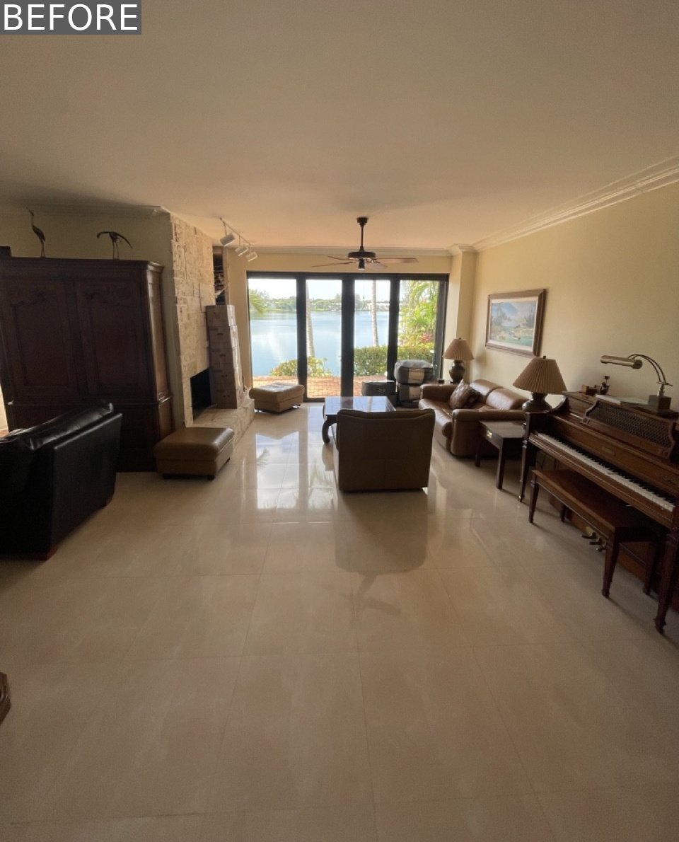 BEFORE - Originally, the living room was divided by a dated, tile-clad fireplace with adjacent wood storage and shelving, elements that visually split the space in two. The renovation reimagined this layout, keeping the dual zones but replacing heavy partitions with organic touches