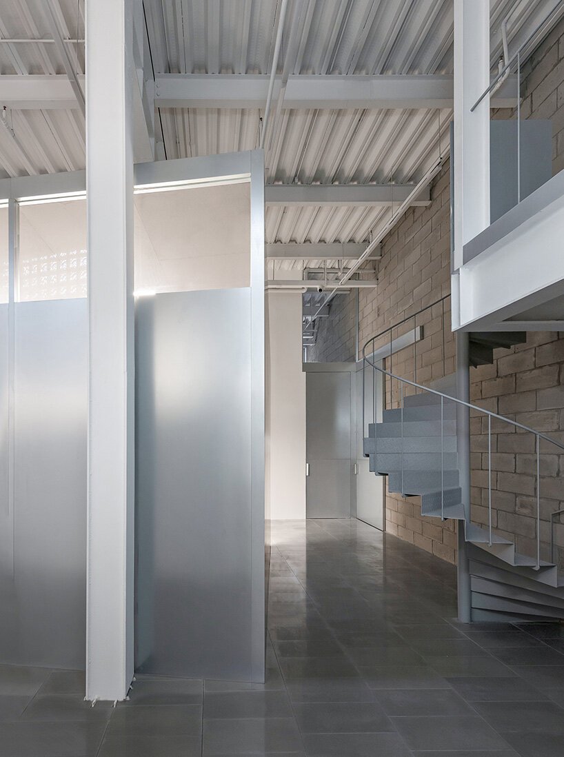 skewed meeting room bends the grid in shanghai office revamp by atelier siyu