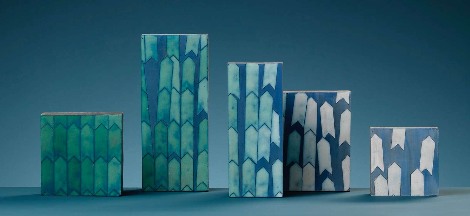a series of patterned ceramic tablets