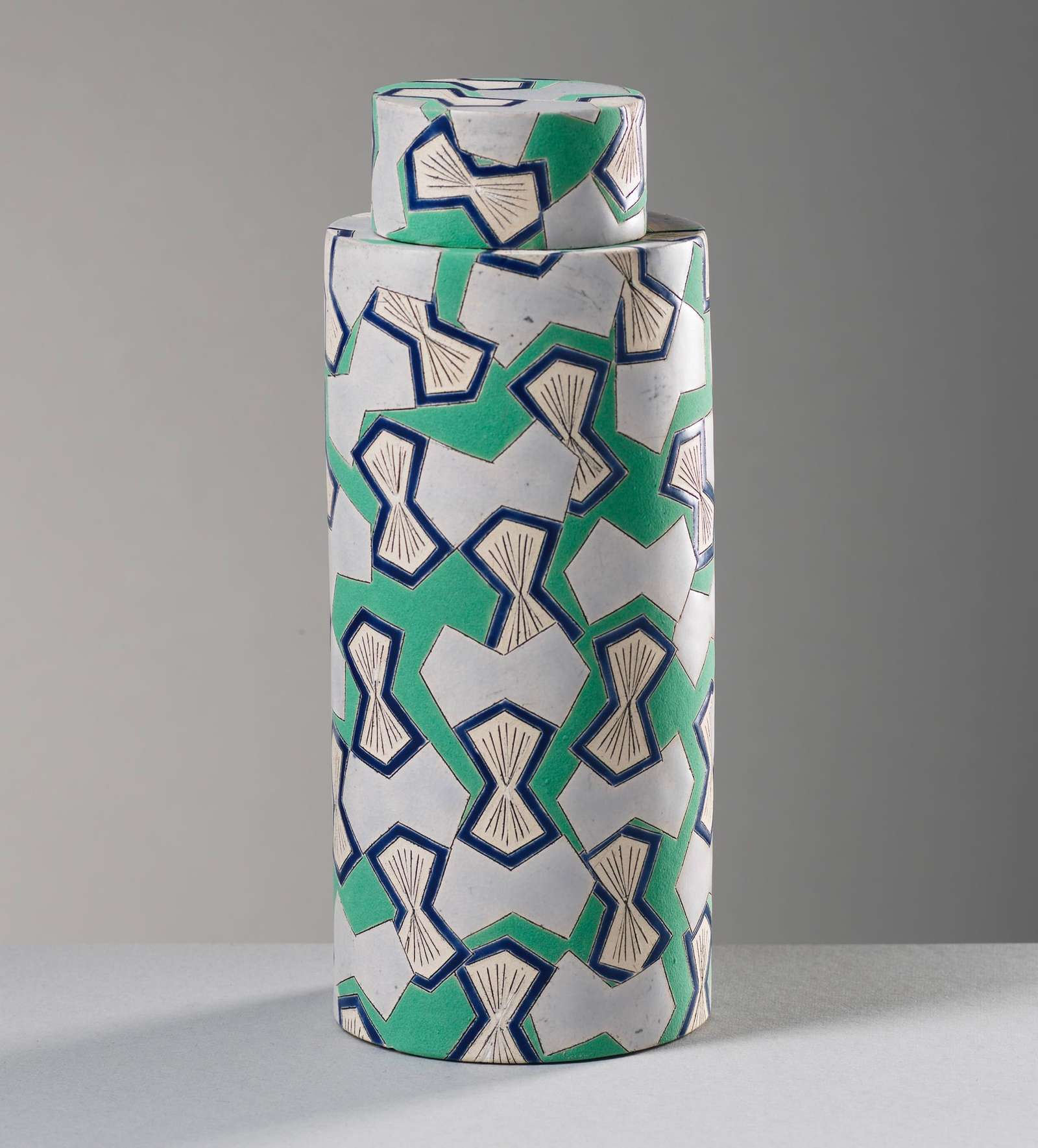 a geometrically patterned, cylindrical jar