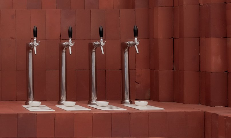 red bricks line the refreshment club's kiln-inspired flagship for parisian porcelain house 