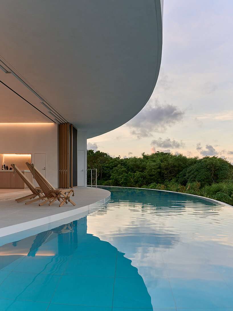 sou fujimoto's circular green-roofed villa for NOT A HOTEL opens on ishigaki island, japan