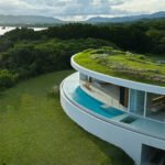 sou fujimoto's circular green-roofed villa for NOT A HOTEL opens on ishigaki island, japan