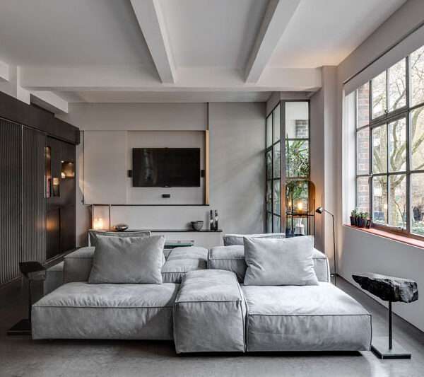 A 1930s shoe factory was converted into a contemporary apartment filled with industrial character and highly personal design details.