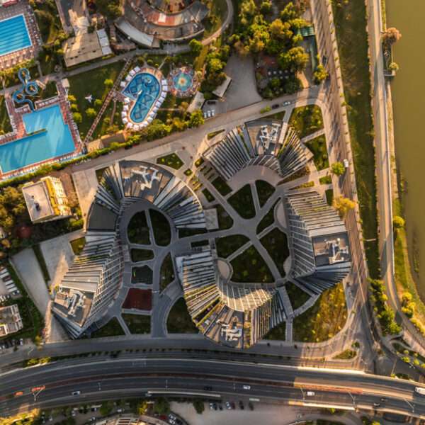 JA joubert architecture sculpts undulating lakefront district following sloped terrain in tirana