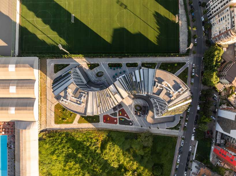 JA joubert architecture sculpts undulating lakefront district following sloped terrain in tirana