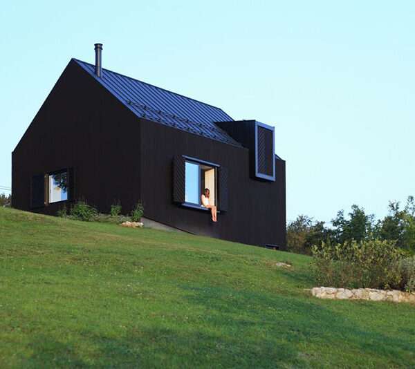 A striking little black house designed by Tomislav Soldo in the hills of Ogulin, Croatia. The blackened wood facade blends into the landscape while opening up to panoramic views of the valley and mountains.