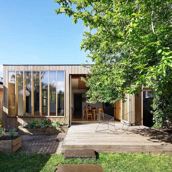 The house began as a turn-of-the-century weatherboard, with a traditional Victorian look at the front. At the rear, however, a bold new extension redefines the home. Known as Wooden Box, the addition is a simple timber structure that continues the original roofline, allowing old and new to sit side by side in harmony.