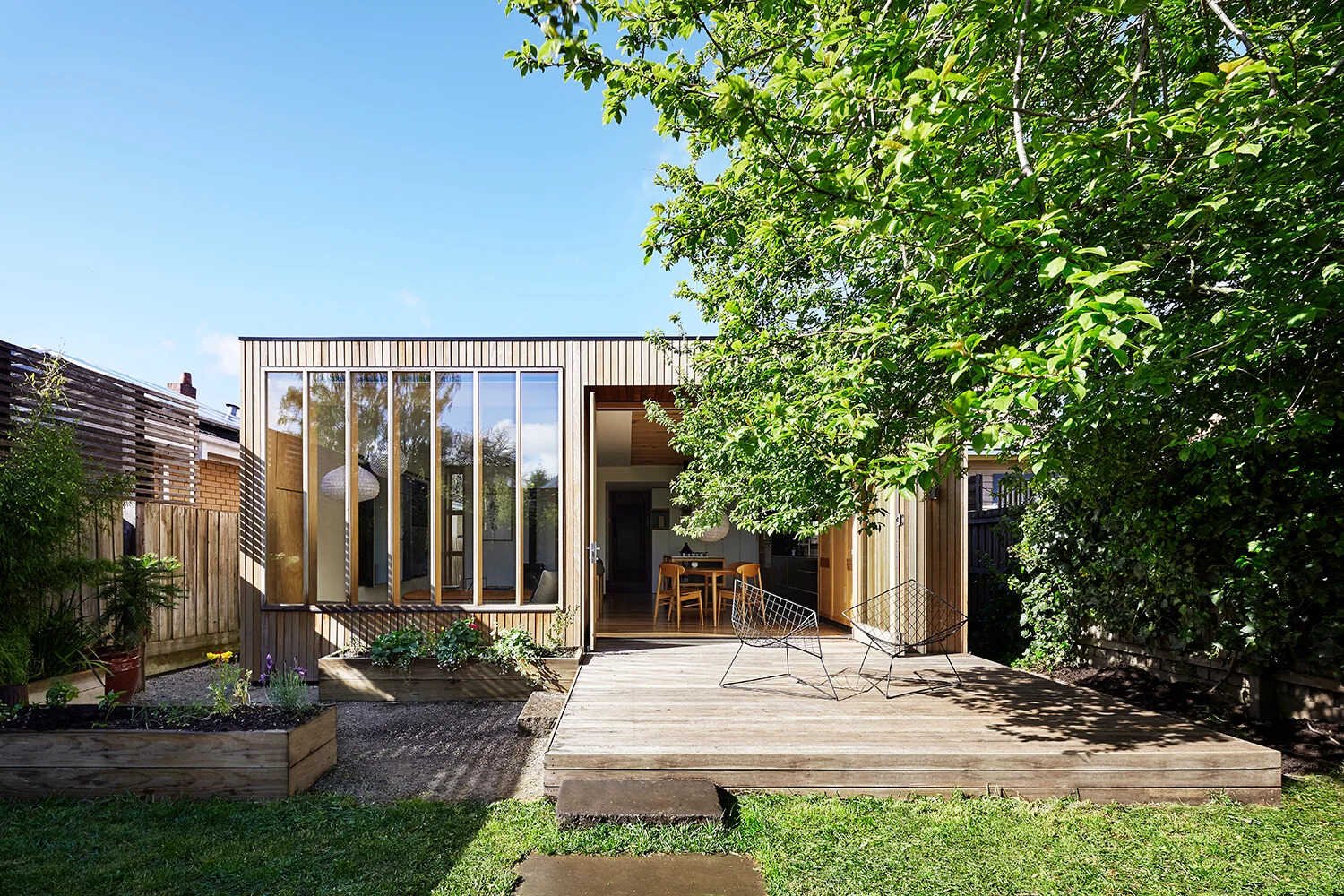 The house began as a turn-of-the-century weatherboard, with a traditional Victorian look at the front. At the rear, however, a bold new extension redefines the home. Known as Wooden Box, the addition is a simple timber structure that continues the original roofline, allowing old and new to sit side by side in harmony.