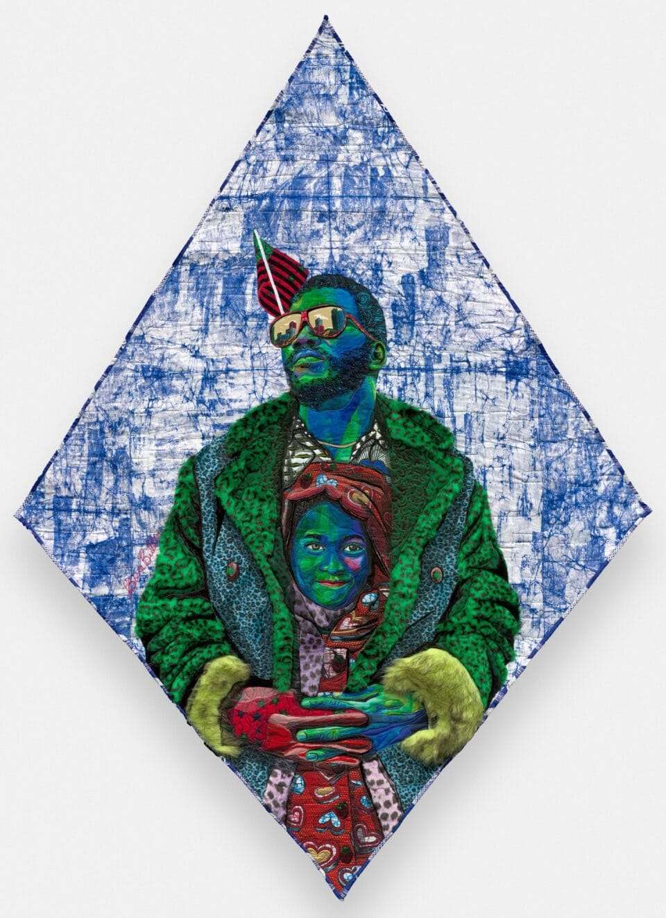 a diamond-shaped composition by Bisa Butler of a Black man in a coat with a child tucked inside the flaps