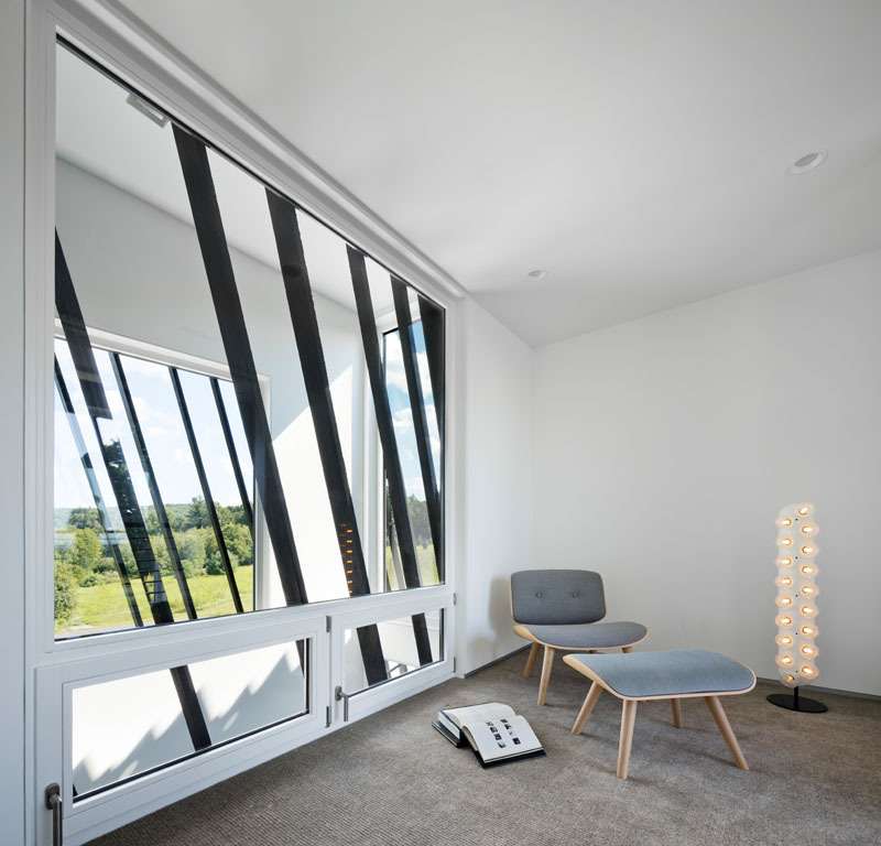 A modern reading nook with large windows.