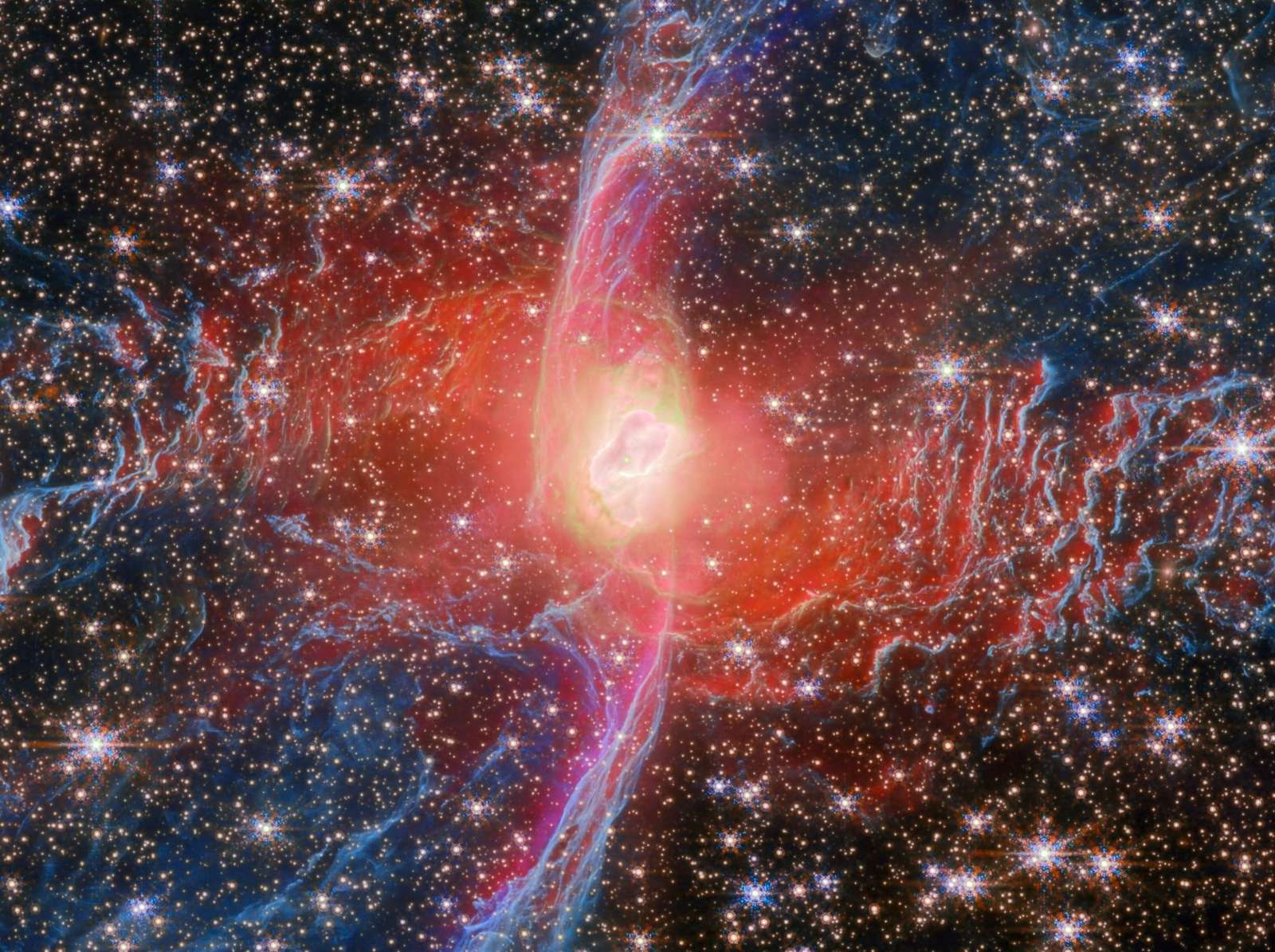 a detail of the bright nucleus star of the Red Spider Nebula, captured by the Webb space telescope