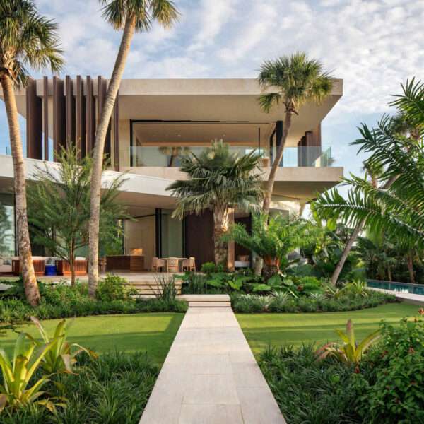 A calm Bahamian villa where coral stone, tropical gardens, and canal side views shape every room.