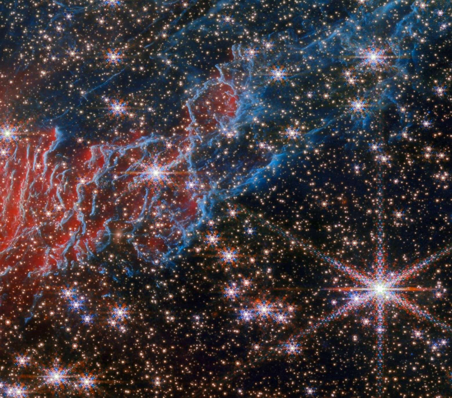 a detail of a gas cloud of the Red Spider Nebula, captured by the Webb space telescope