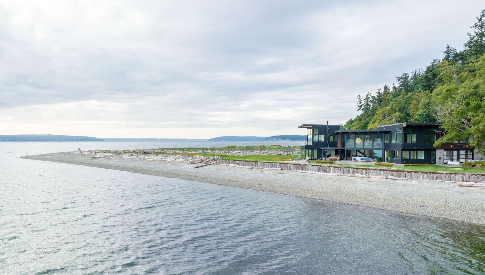 This coastal home shows how architecture can respond directly to land, regulation, and risk. Designed within an existing footprint, the form reflects shoreline rules, steep slopes, and long term durability in a marine environment.
