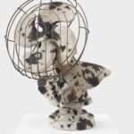 a ceramic sculpture by Stephanie Temma Heir of a cow-printed bust-turned-fan