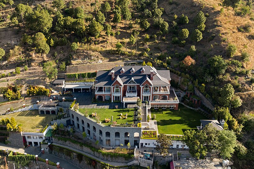 stepped residence embedded into the hillside maximizes views and privacy in india