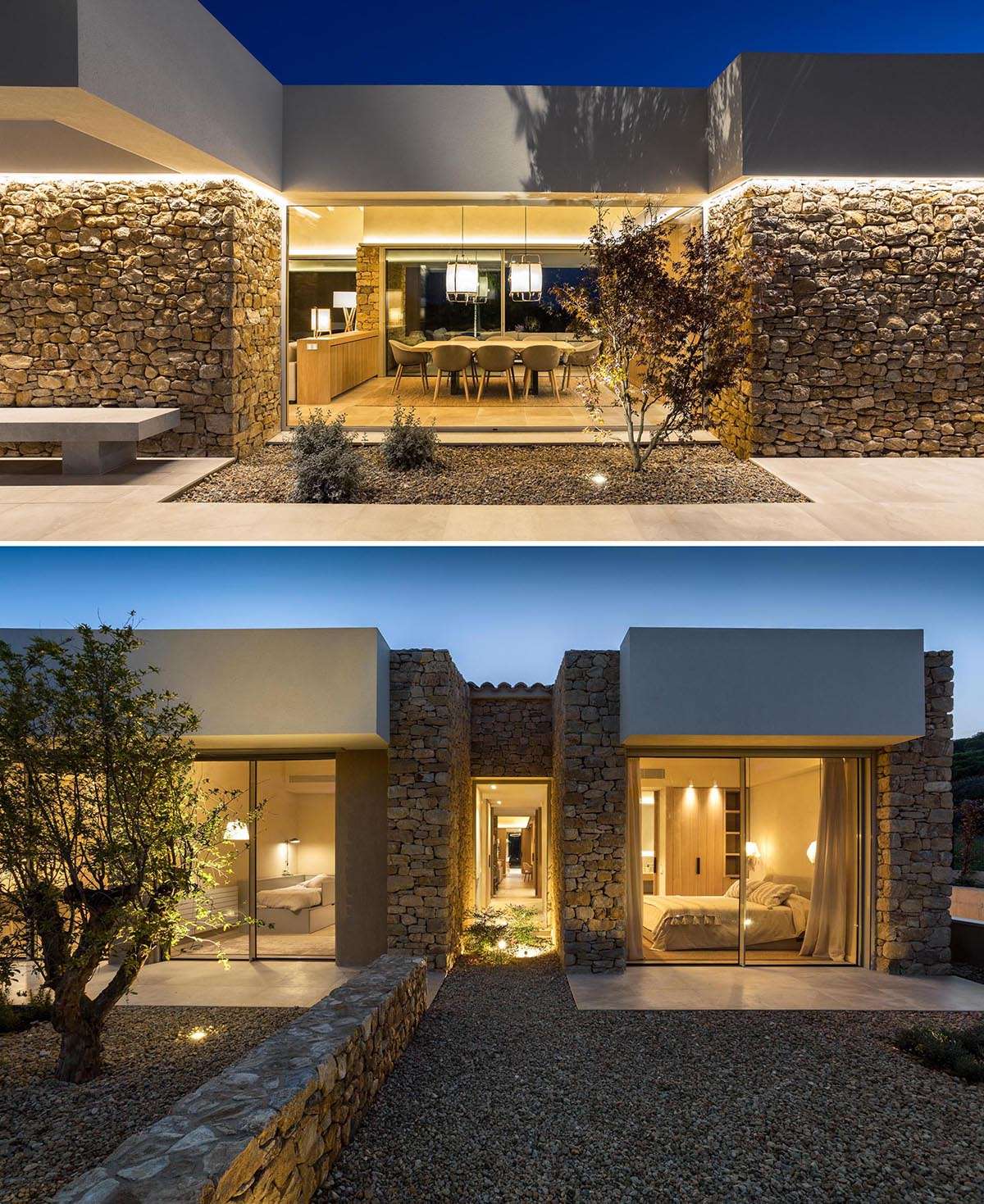 A modern stone house that has large windows and hidden lighting.