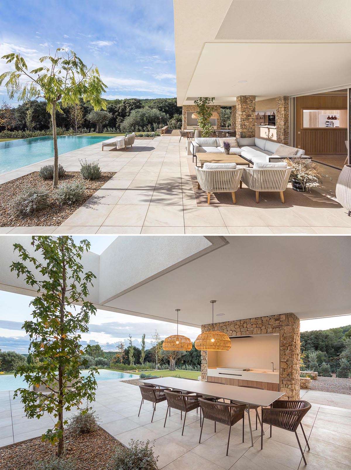 This modern house has an infinity edge swimming pool with views of the surrounding area, while the covered patio includes a lounge area with a sofa and armchairs, as well as a dining area with an outdoor kitchen.