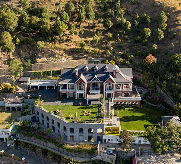 stepped residence embedded into the hillside maximizes views and privacy in india