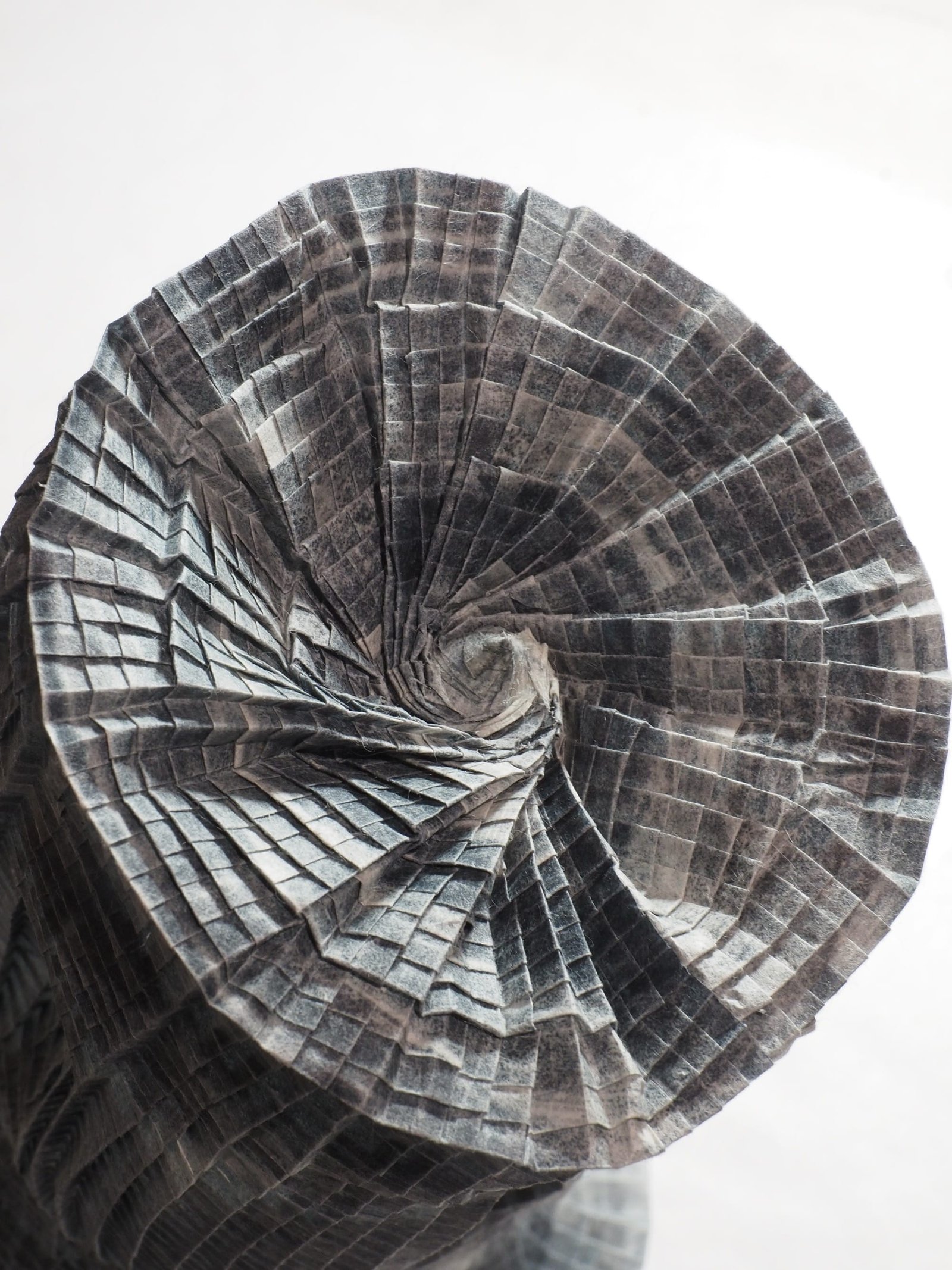 The base of an origami paper vase