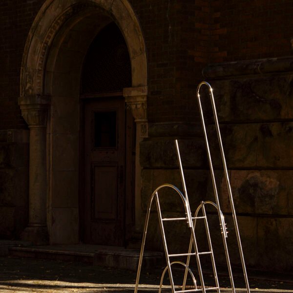 sculptural steel ladder imitates the flowing geometries of brass musical instruments - 1