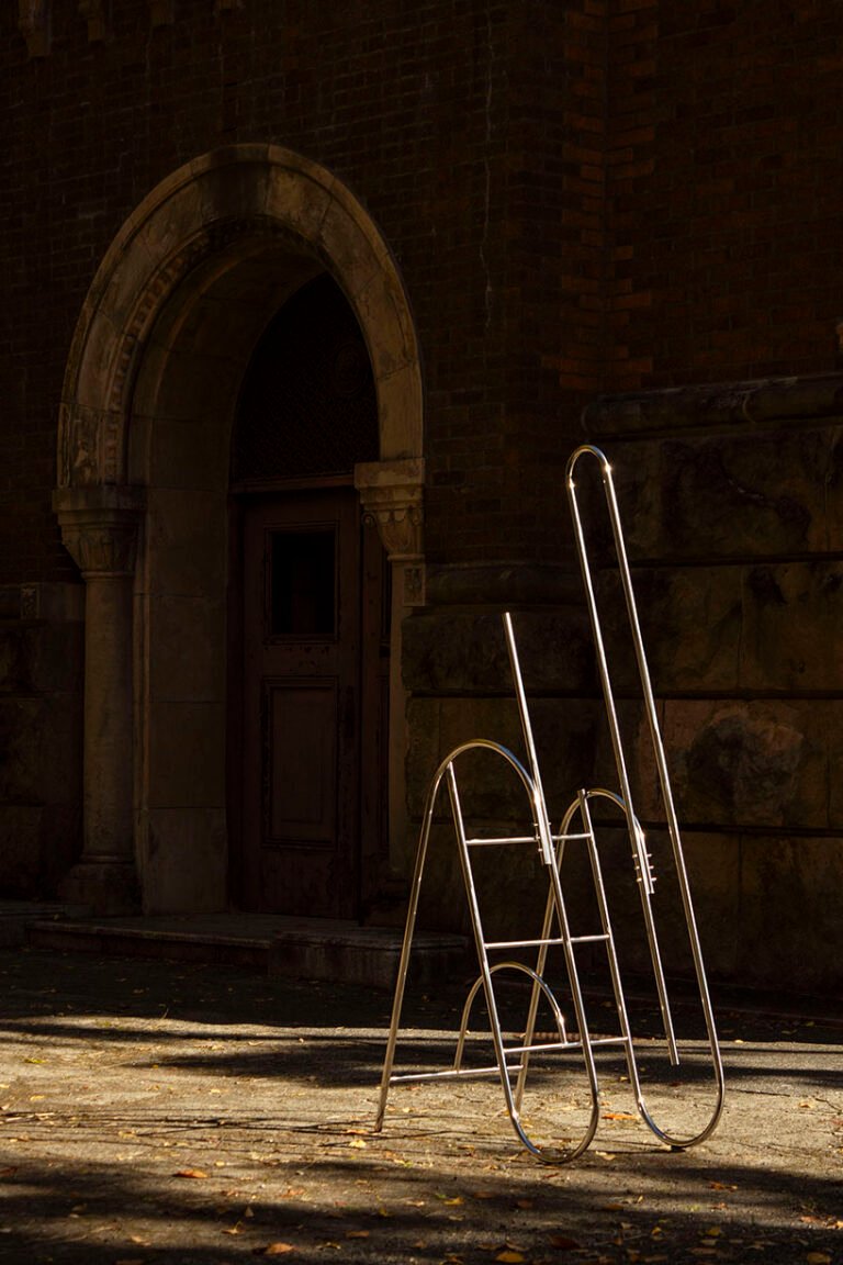 sculptural steel ladder imitates the flowing geometries of brass musical instruments - 1
