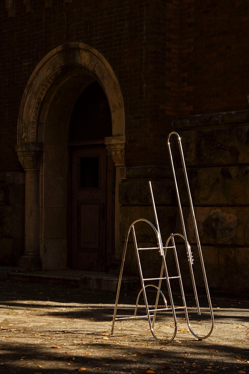 sculptural steel ladder imitates the flowing geometries of brass musical instruments - 1