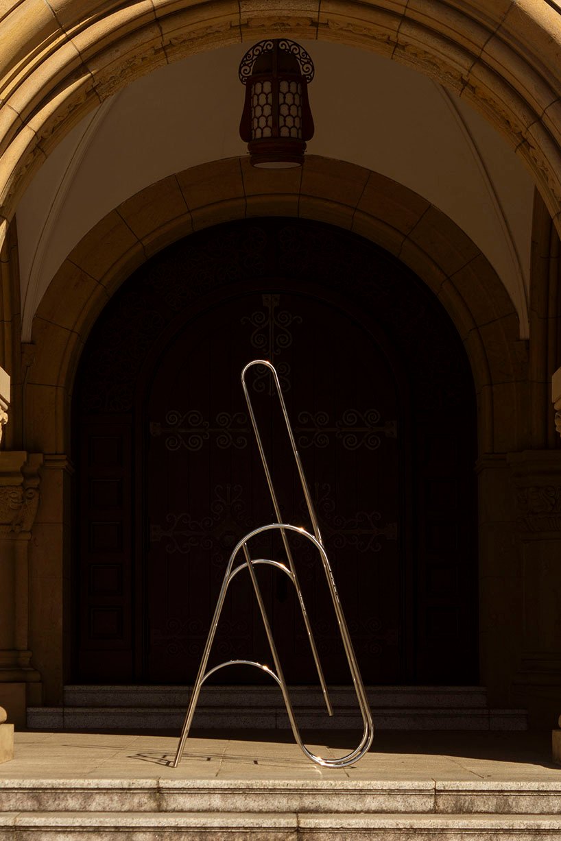 sculptural steel ladder imitates the flowing geometries of brass musical instruments - 6
