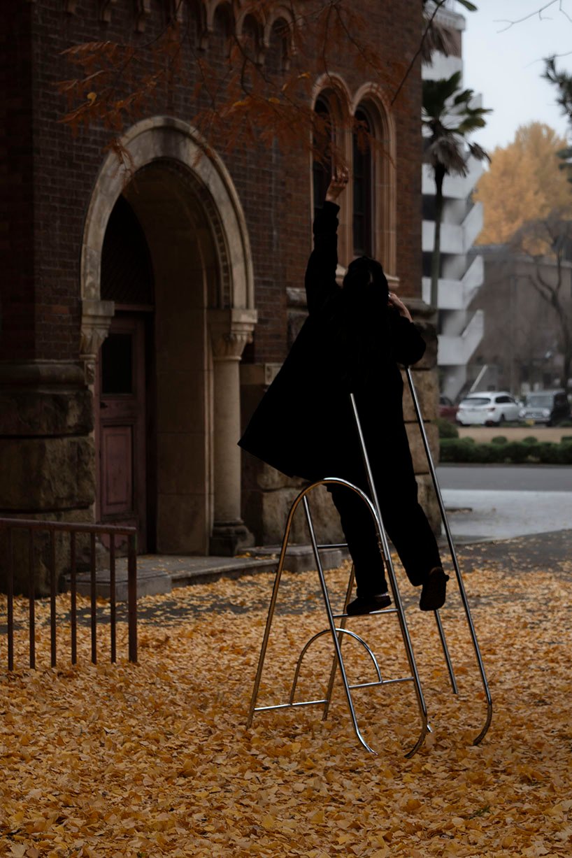 sculptural steel ladder imitates the flowing geometries of brass musical instruments - 7