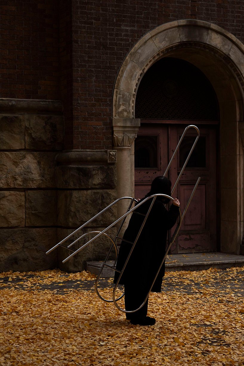 sculptural steel ladder imitates the flowing geometries of brass musical instruments - 8