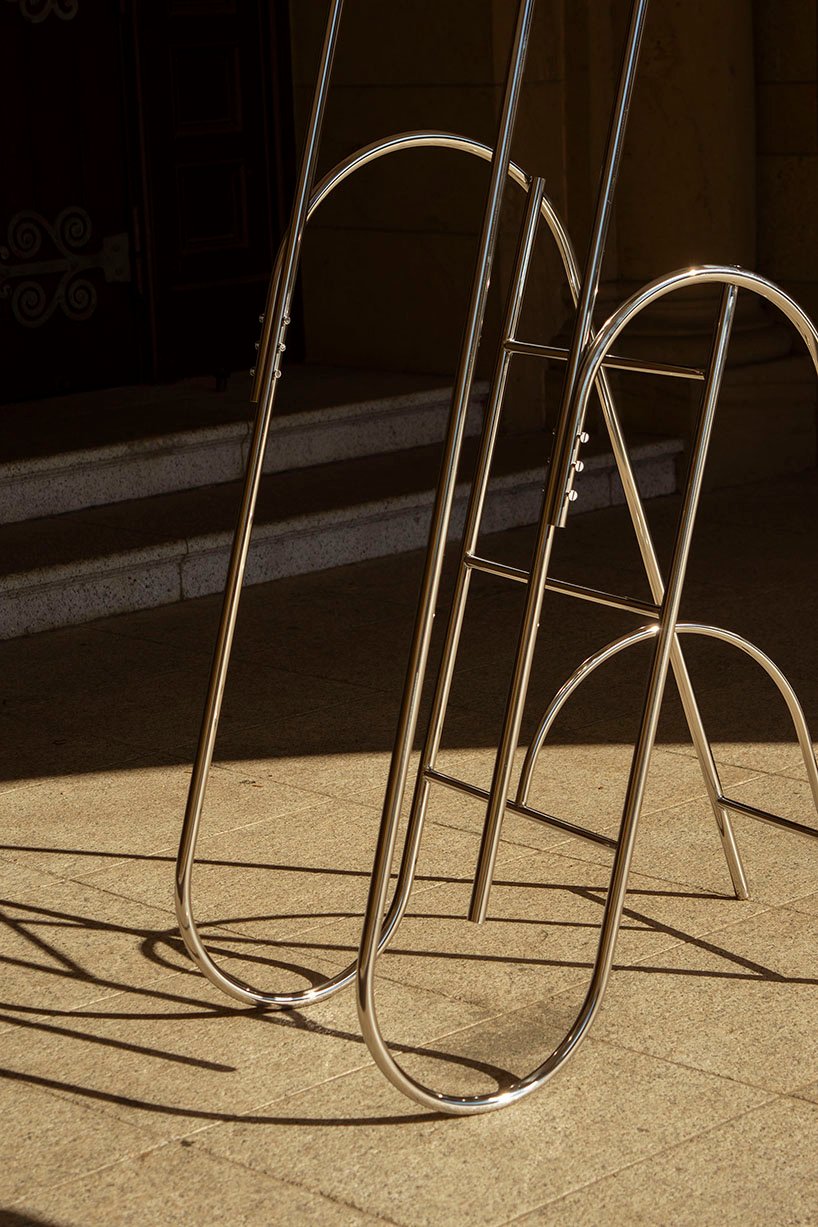 sculptural steel ladder imitates the flowing geometries of brass musical instruments - 9
