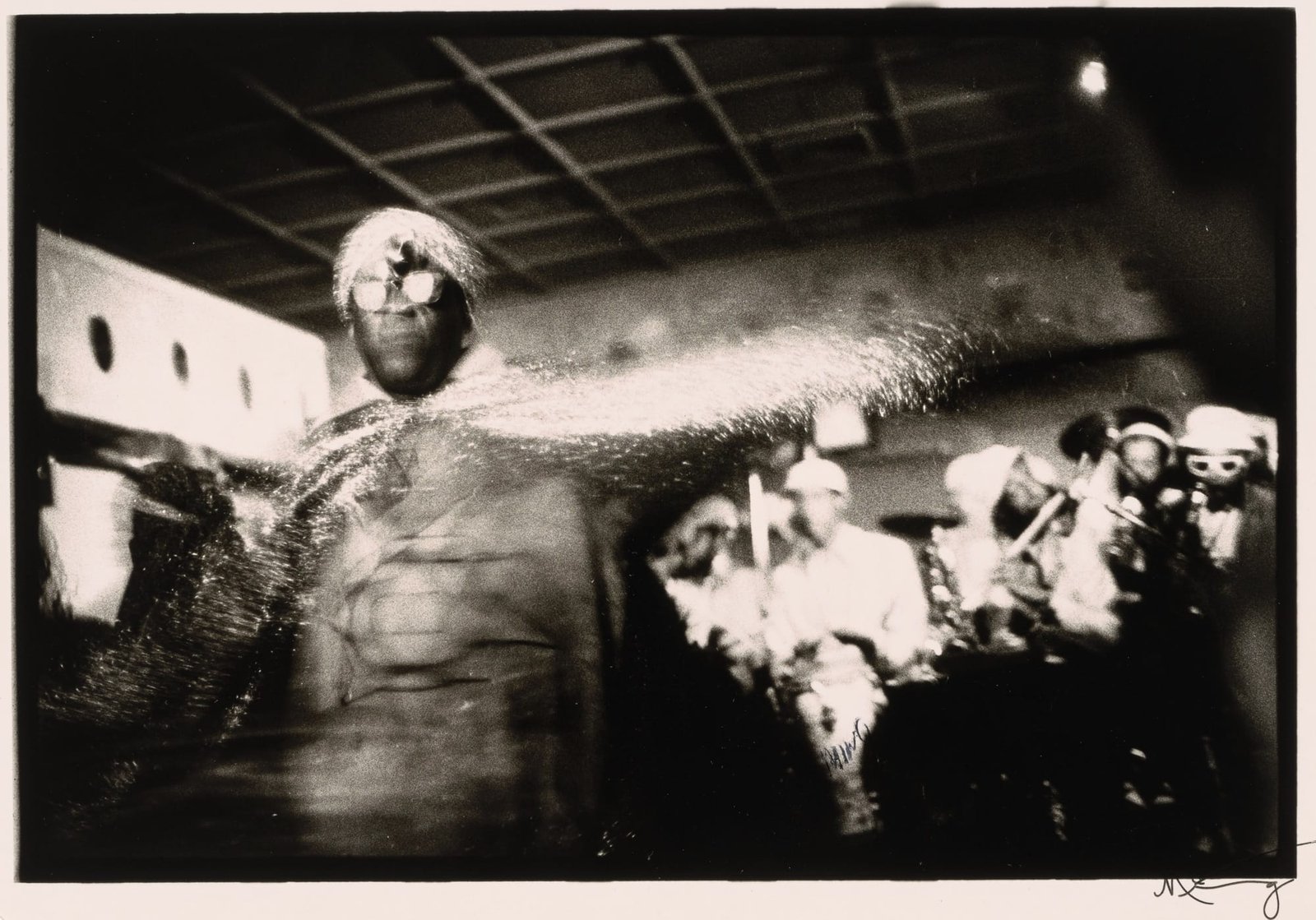 a black and white photo of the musician in a space costume