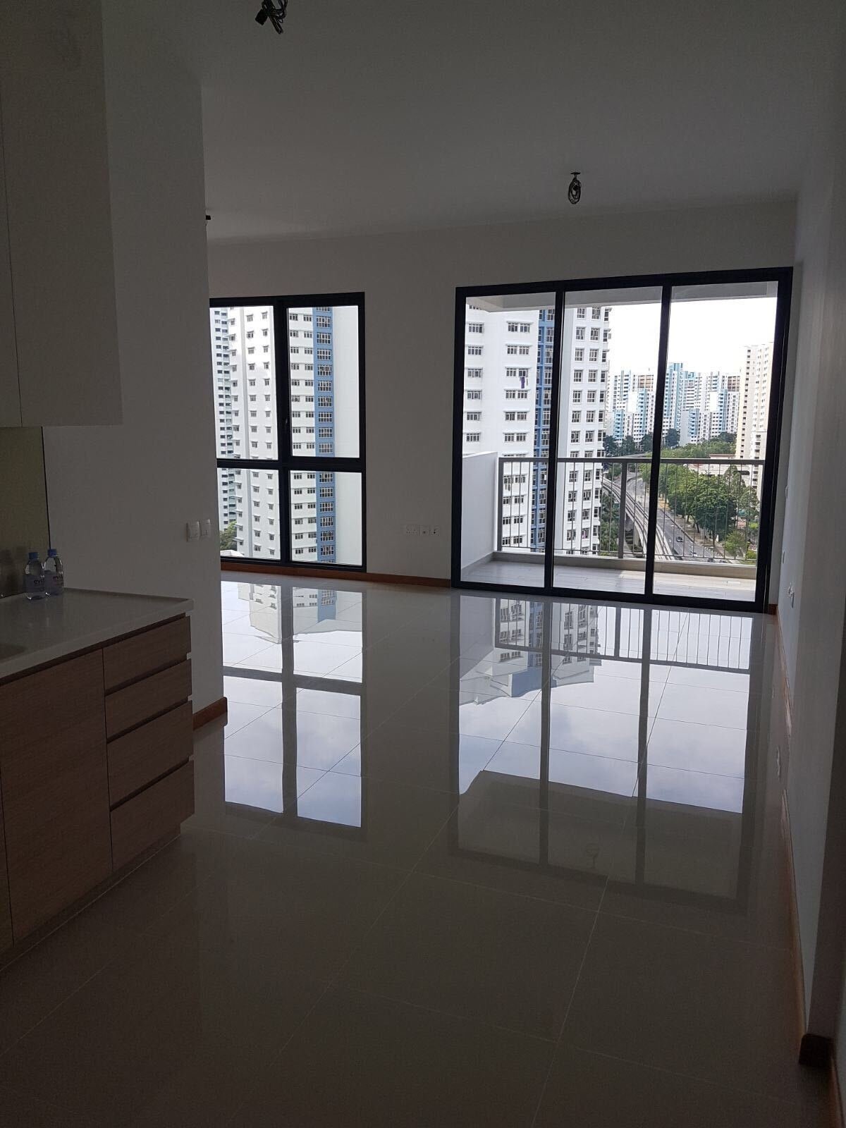 See the before photos of this tiny Singapore studio apartment and how its plain interior became a warm, space-saving home filled with custom design ideas.