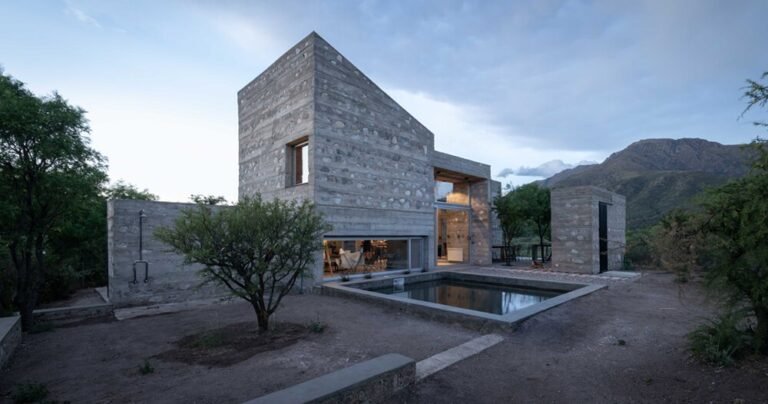 nanzer | vitas echoes a ruinous fortress in argentina with its stone-clad casa DP