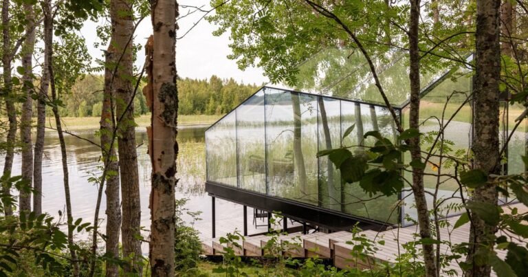 mirrored glass cabin with panoramic views disappears into finland’s rich natural landscape