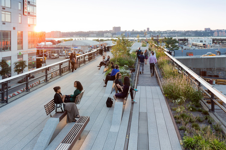 Where Are the Architectural Masterpieces?, View looking west at sunset. Conversation benches and a Rail Track Walk are visible. . Image © Iwan Baan, 2014