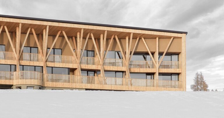 MoDusArchitects unveils its icaro lodge, a forest of timber columns within the dolomites